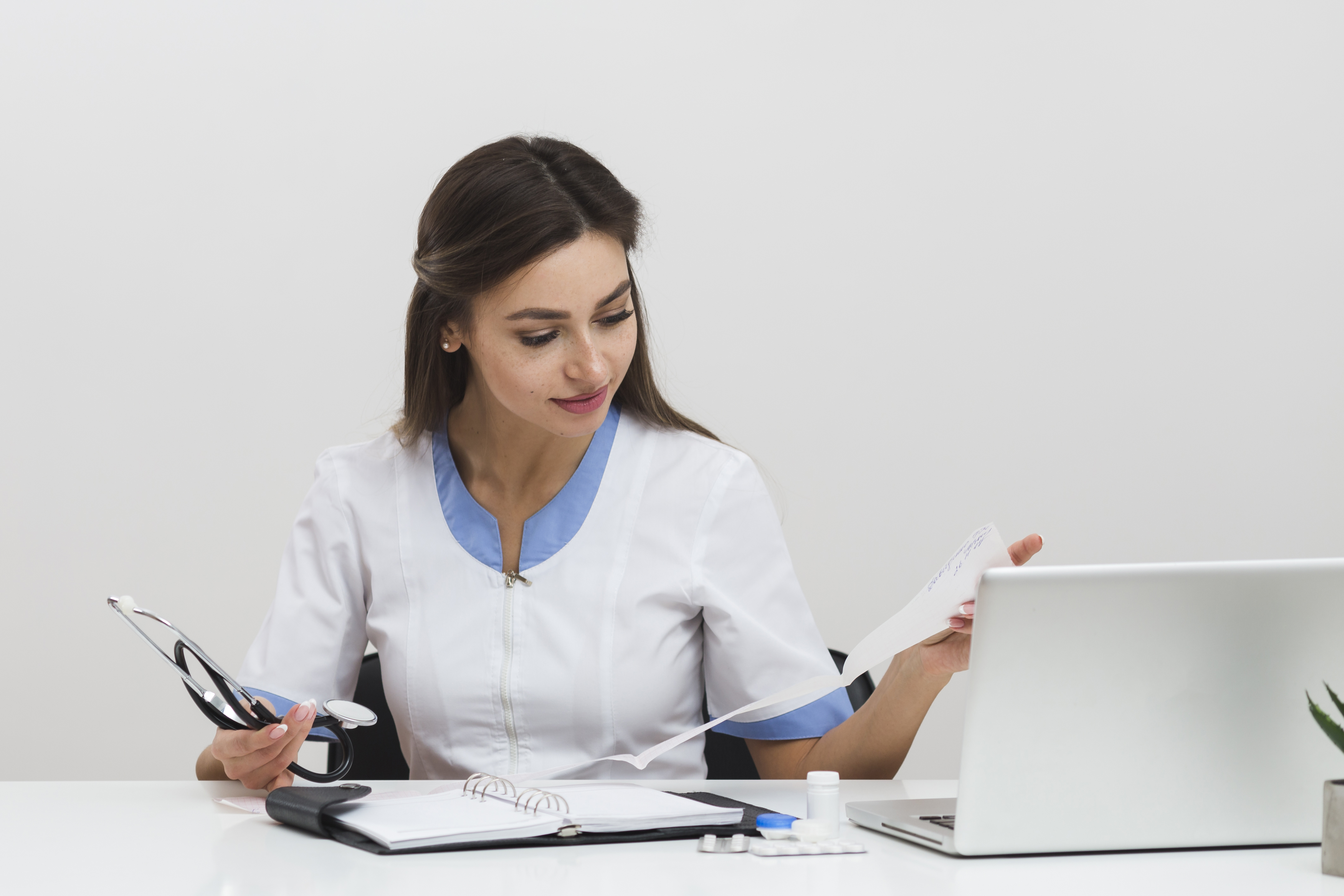 young female doctor looking n medical reports